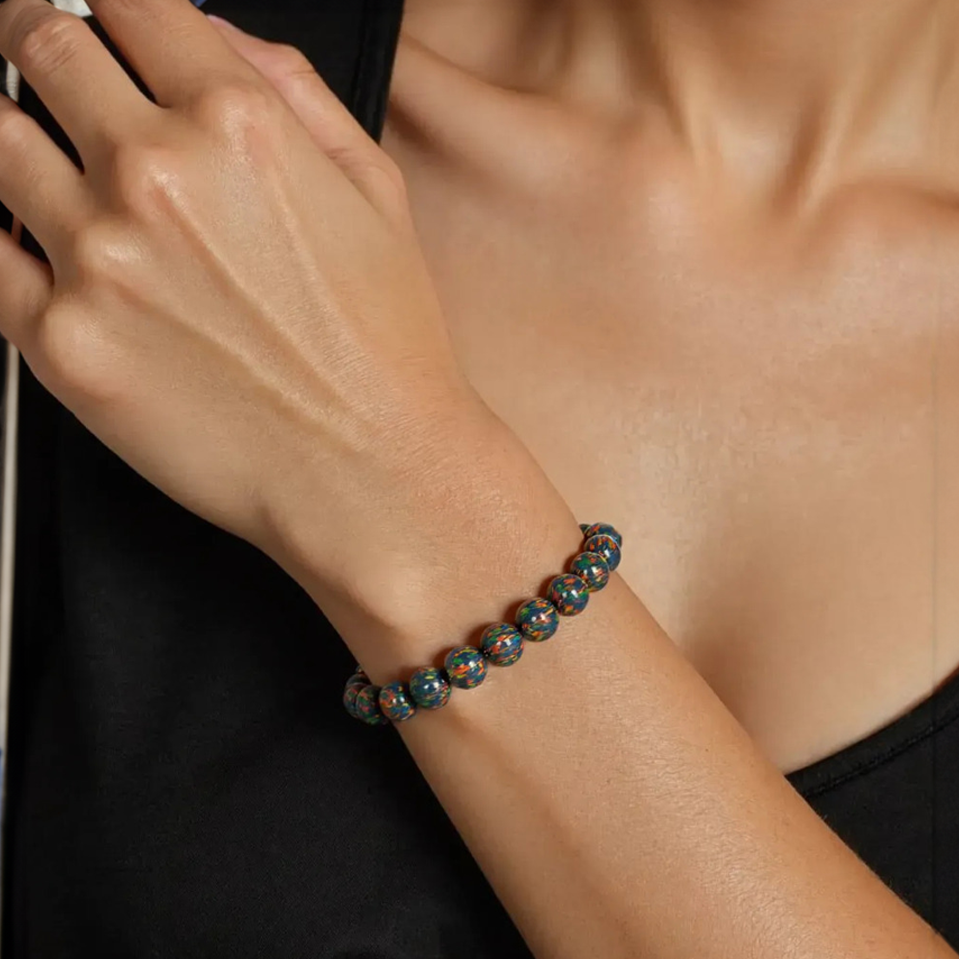model wearing black fire opal bracelet | the opal dealer